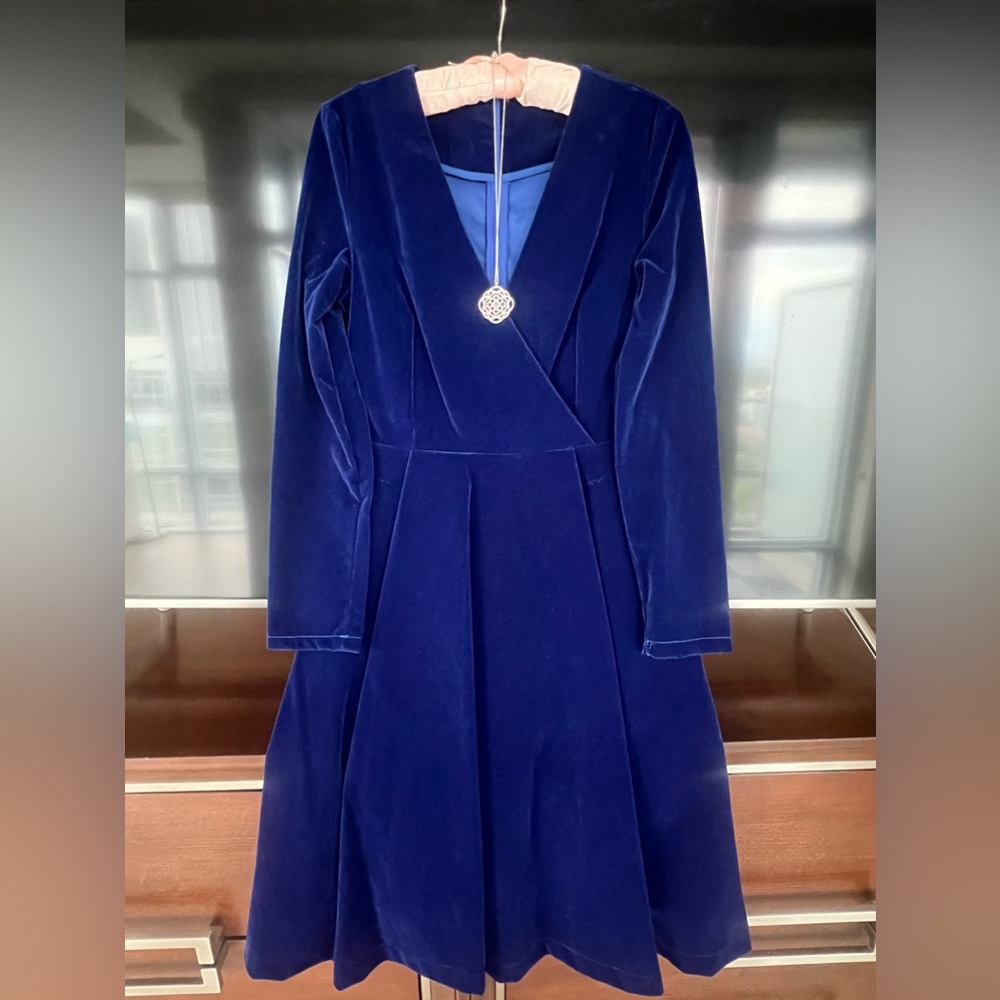 Knee length velvet dress.
